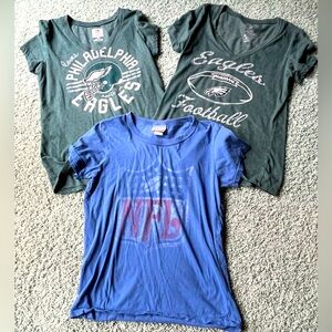 Three NFL short sleeve shirts - two are Philadelphia Eagles.  Size Med